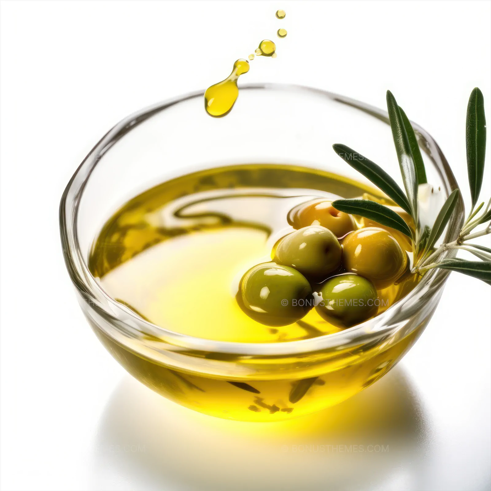 Olive oil in a bowl with olives