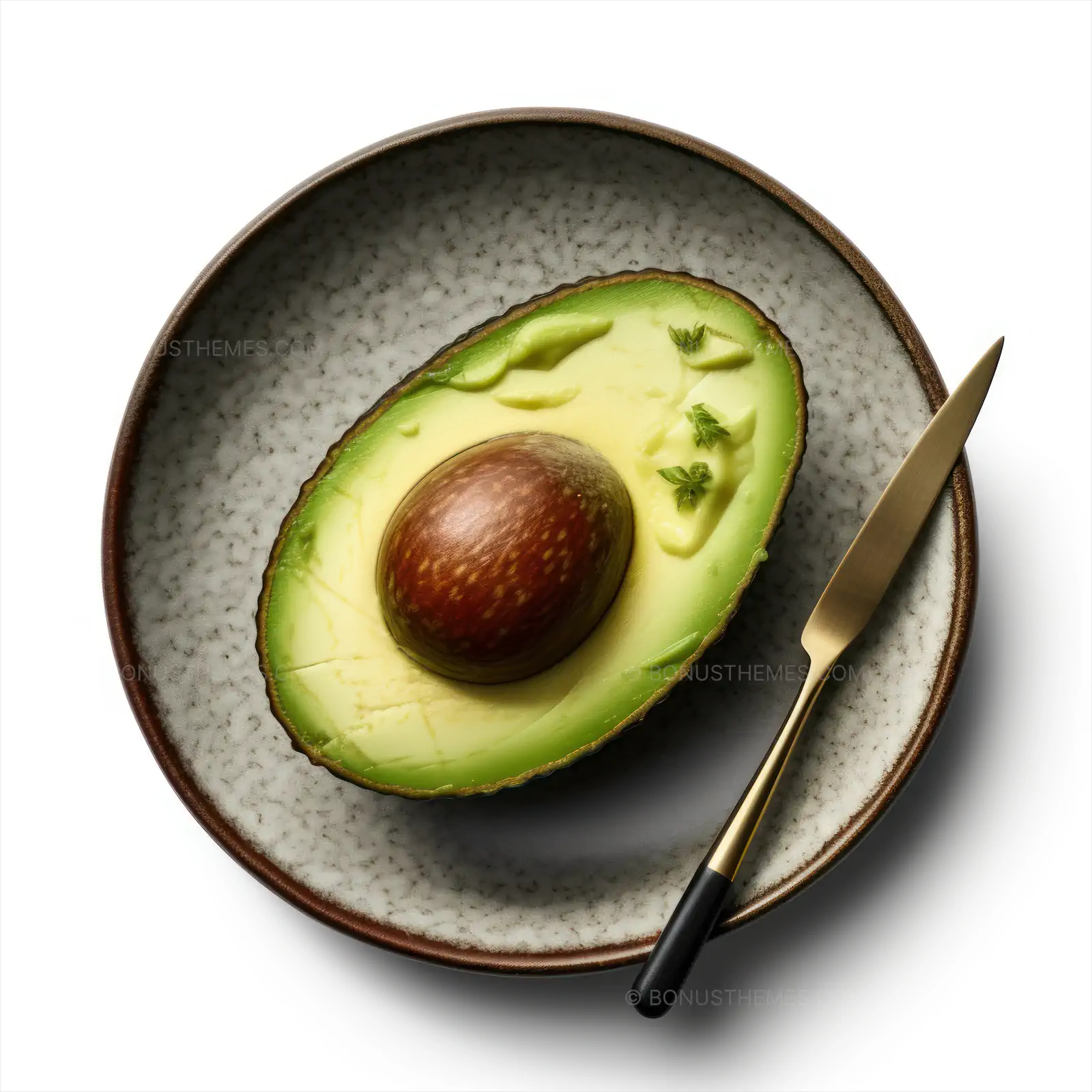 Avocado fruit on a plate from top view
